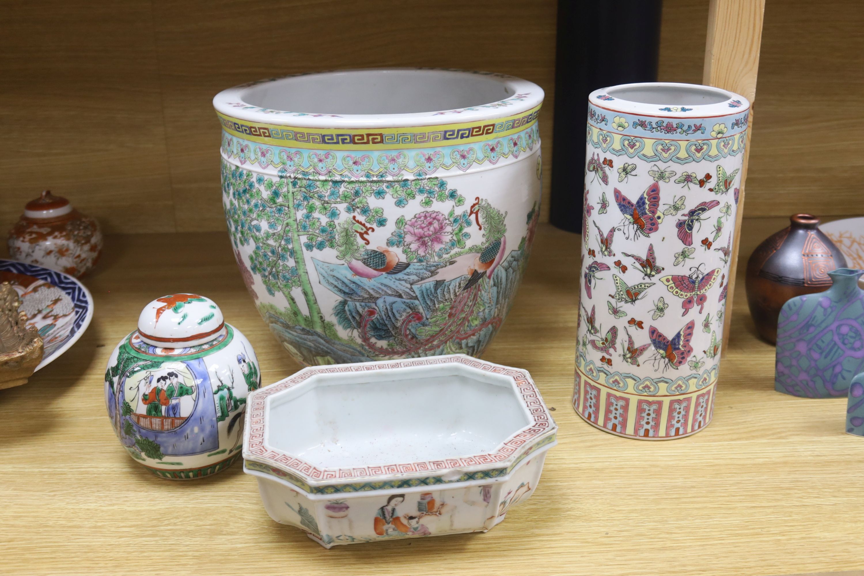 A Chinese famille rose jardiniere, a late 19th century famille rose narcissus pot, a cylindrical vase and a famille verte jar and cover, tallest 28.5cm